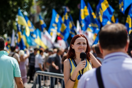 Journalist making report with protestors of  Rise up, Ukraine   demonstration in Kiev, Ukraine on May 18, 2013   Rise up, Ukraine   - a political protest by opposition parties against the regime of President of Ukraine Viktor Yanukovych のeditorial素材