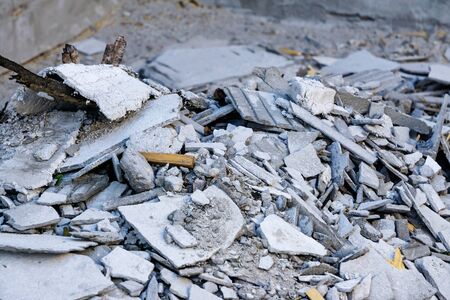 Construction waste. Broken concrete block, garbage bricks, rubble, broken slate, materials from a demolished houseの写真素材