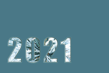 Happy new year 2021. White numbers for 2021, with the texture of spruce branches, on an isolated...