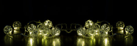 Christmas and new year luminous banner, with festive decoration, garland. Close-up, selective focus,...