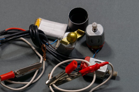 Electronic waste: wires, small motors, terminals, and other electrical components. Selective focus,...