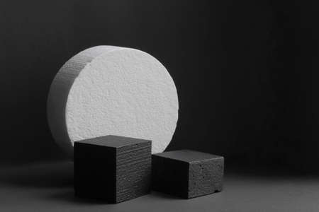 3d podium made of geometric shapes. Two black square platforms for the presentation of products, cosmetics on the background of round white stage. Concept of beauty industryの写真素材