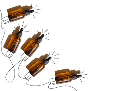 New Year's garland of mock-ups of glass dropper bottles with shade on white isolated background....