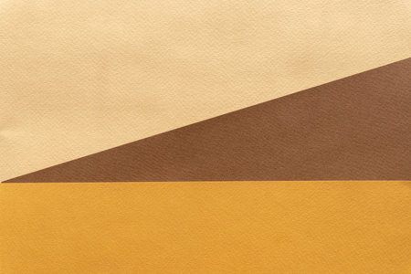 Abstract textured background of geometric shapes, triangles, three colors: brown, beige, orange....
