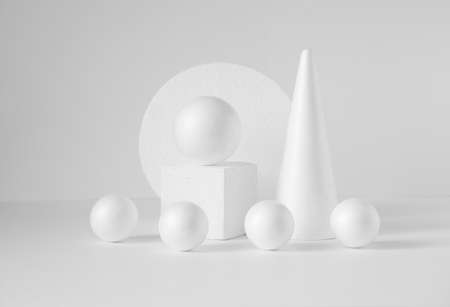 Monochrome composition of various 3d geometric shapes. White balls of different sizes, cube, cone, on an isolated background. Concept of visual aid.の写真素材