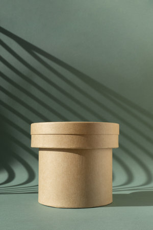 Empty modern round podium or pedestal on green background with Light on wall. Blank 3d backdrop for product presentation.の写真素材