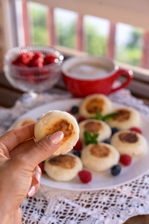 Cottage cheese pancakes with raspberries.の写真素材