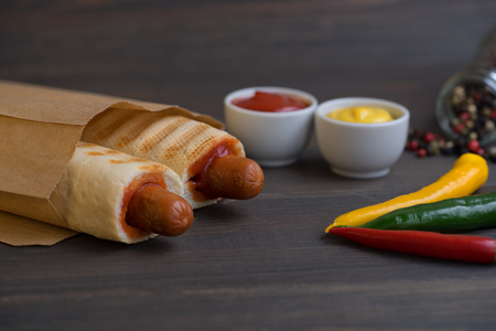 Barbecue Grilled Hot Dog with Yellow Mustard and ketchupの写真素材