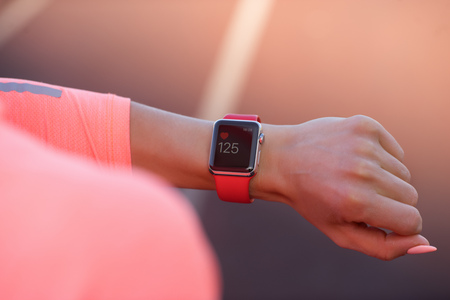 Sport woman looking at smart watchの写真素材