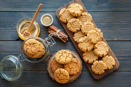 peanut butter and honey cookies on a dark wood backgroundの写真素材