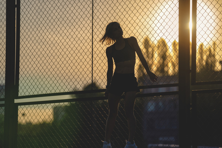 Portrait of a girl at a sports stadiumの写真素材