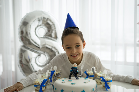 Parents congratulate the 8 years Boy with birthdayの写真素材