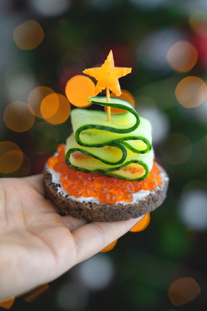 Sandwiches with red caviar decorated with cucumbers and carrot. Wedding buffetの写真素材