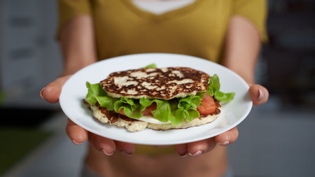 Keto Diet Bread Sandwich in female hands.