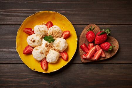 Cottage cheese dumplings with strawberry. Boiled, breakfast.の写真素材