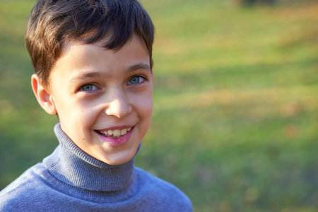 Little boy portrait with big smile outside