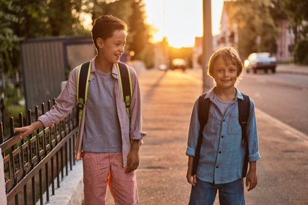 School boys running to school. School boys having fun after school.