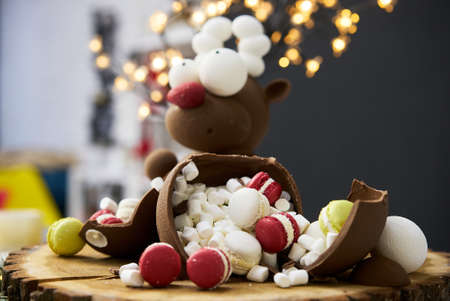 Christmas sweets and cookies. Box with tasty Christmas cookies on wooden tableの写真素材