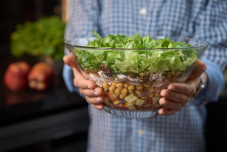 Healthy food at home. Beautiful cauasian woman standing smiling holding bowl salad a health...