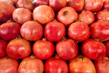 Ripe and juicy Turkish pomegranate close-up. High quality organic products.の写真素材