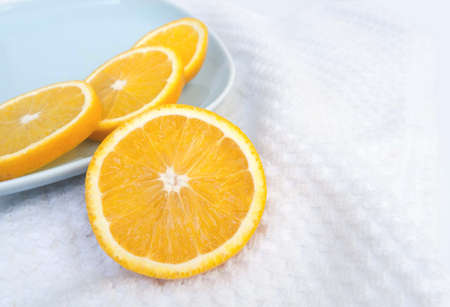 juicy orange cut into slicesの写真素材