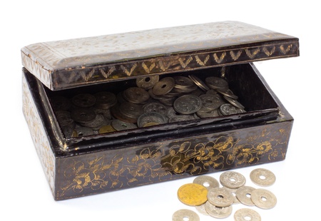 Wooden casket full of ancient coins thai の写真素材