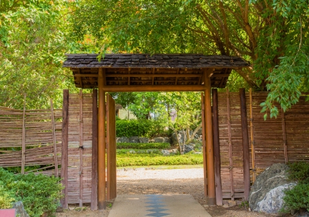 Opened wooden gate in the gardenの写真素材