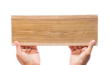 hand holding wooden isolated on white backgroundの写真素材