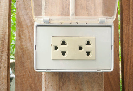 Electrical outlet on wood , outdoor.