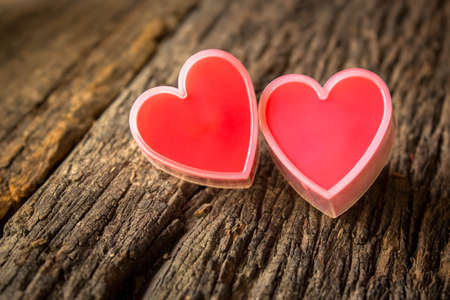 Red heart on old wood.の写真素材