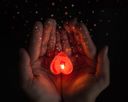 burning heart shaped candles on hands.