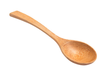 Close-up of wooden spoon isolated over white.の写真素材