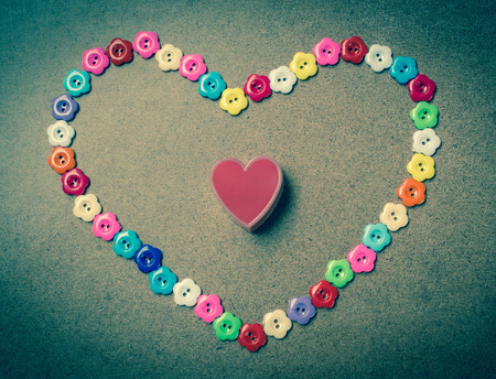 I love you written with flower button on wood,Valentines day background.の写真素材