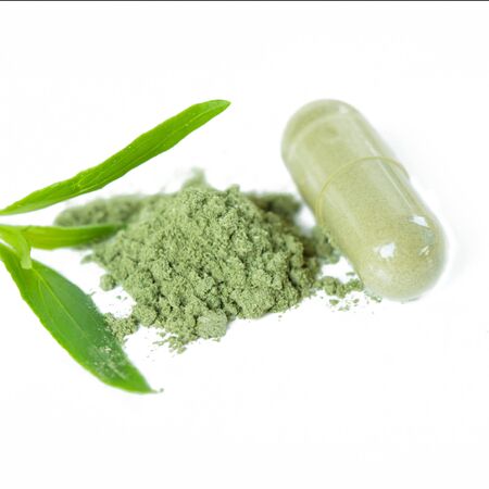 Close up andrographis paniculata herbal antipyretic capsules isolated on whiteの写真素材
