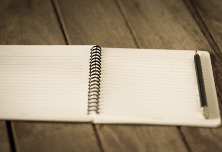 Open a blank white notebook on the table.