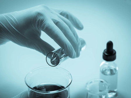 Scientist hand holding a Test tubes,Laboratory research.の写真素材