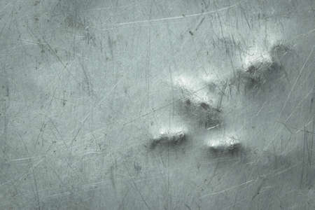 scratched grunge metal plate industrial ; abstract backgroundの写真素材