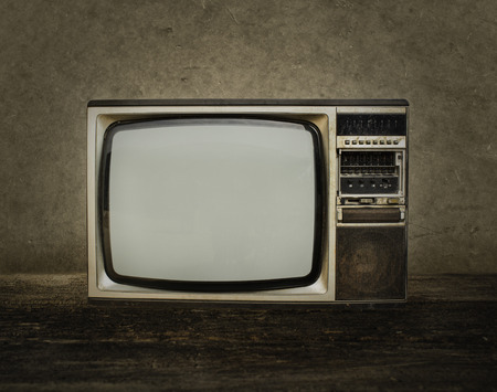 Old tv on wood in room.の写真素材