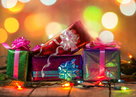 Set of Christmas gift boxes with light on wood.の写真素材