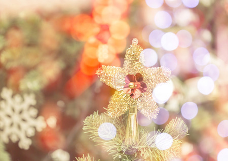 Decorated Christmas tree with star and bokeh light.の写真素材