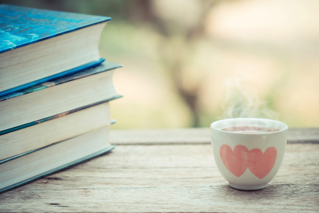 cup of tea with book on the table.の写真素材