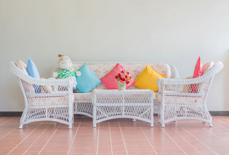 Vintage chair in living room with pillows.の写真素材