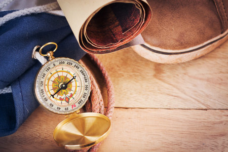 compass on vintage map with accessory to the Adventure.