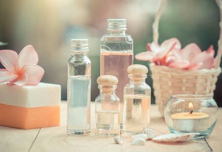 Spa treatment with scented candles and soap on wood.の写真素材