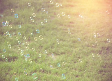 Rainbow bubbles from the bubble blower,vintage background.の写真素材