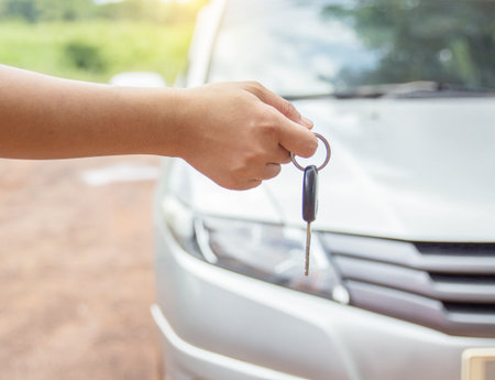Woman's hand pressed on the remote control car with vintage filter.の写真素材