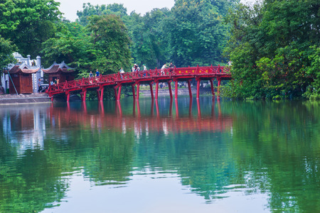 Hanoi, Vietnam - August 2016. Hanoi Red Bridge.The wooden red-painted bridge over the Hoan Kiem Lake connects the shore and the Jade Island on which Ngoc Son Temple stands. Hanoi on August 12, 2016のeditorial素材