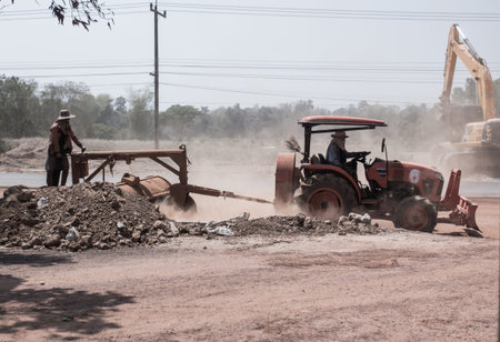Road construction works with machine.