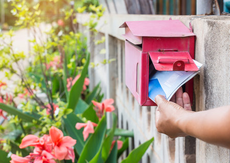 Close-up Of Woman hand Putting Letter in Mailbox.