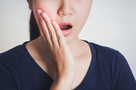 Woman has toothache,Tooth Pain And Dentistry. 
の写真素材